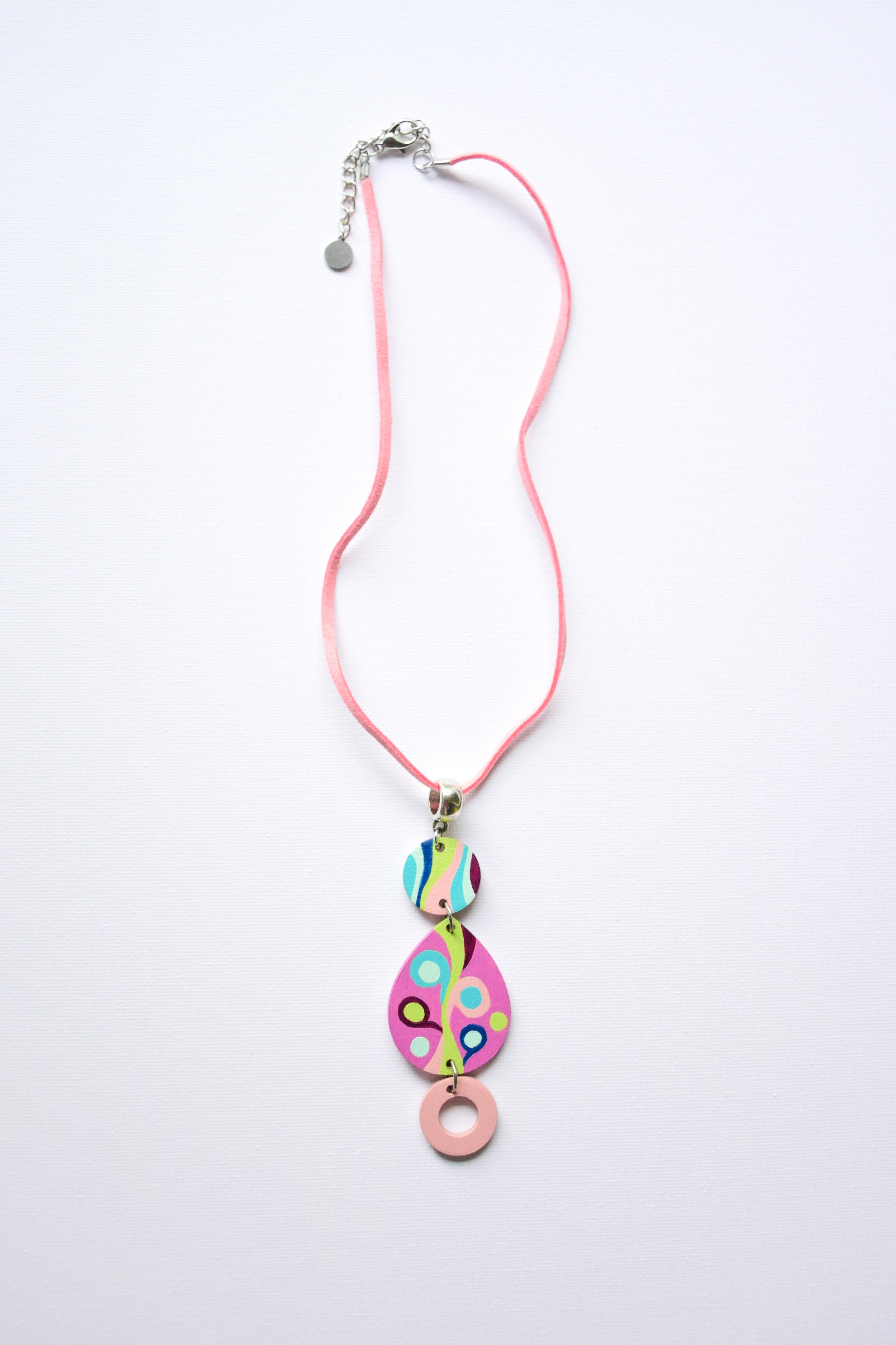 Leather cord necklace with a colorful hand-painted pendant on a white background
