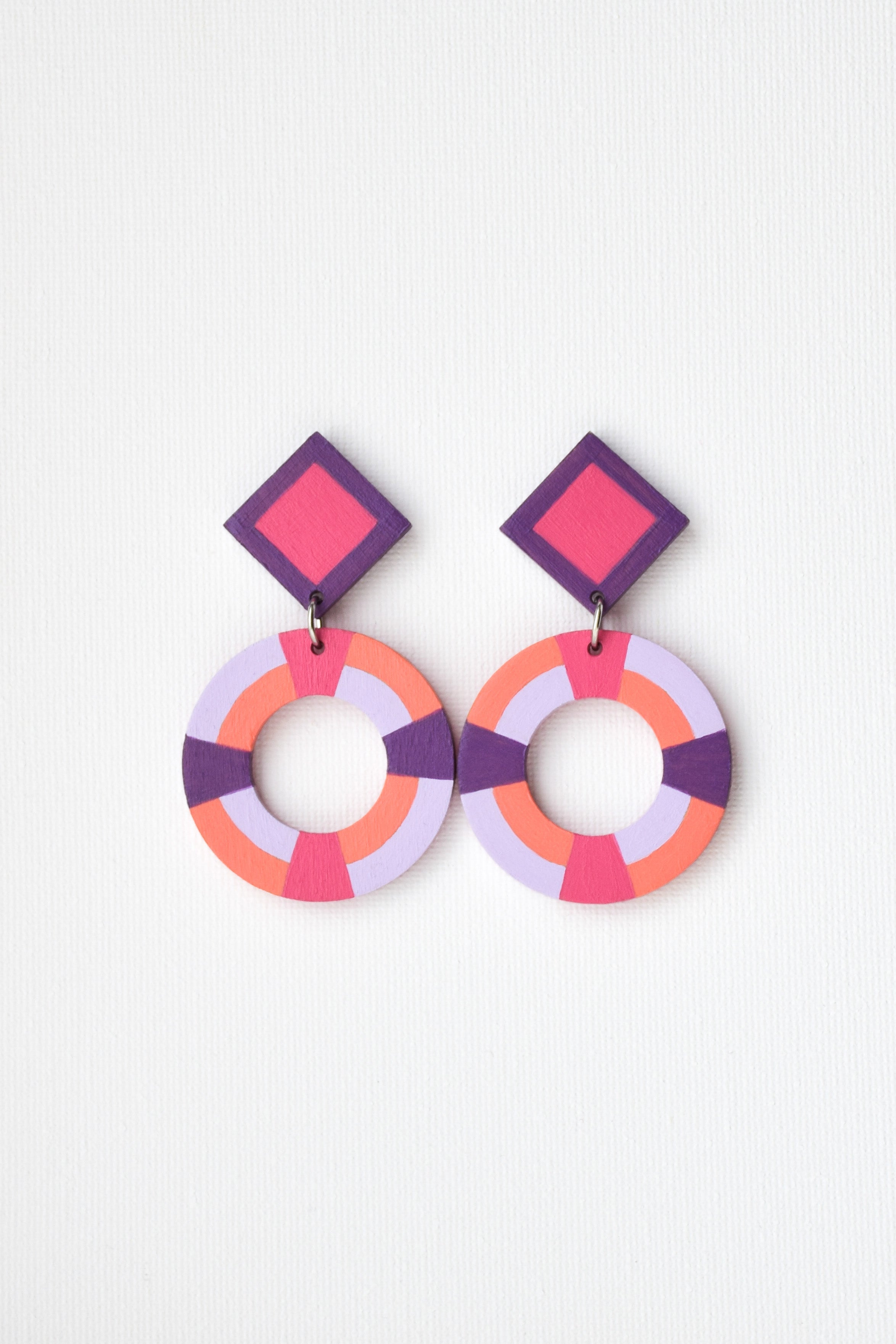 Colorful geometric earrings on a white background