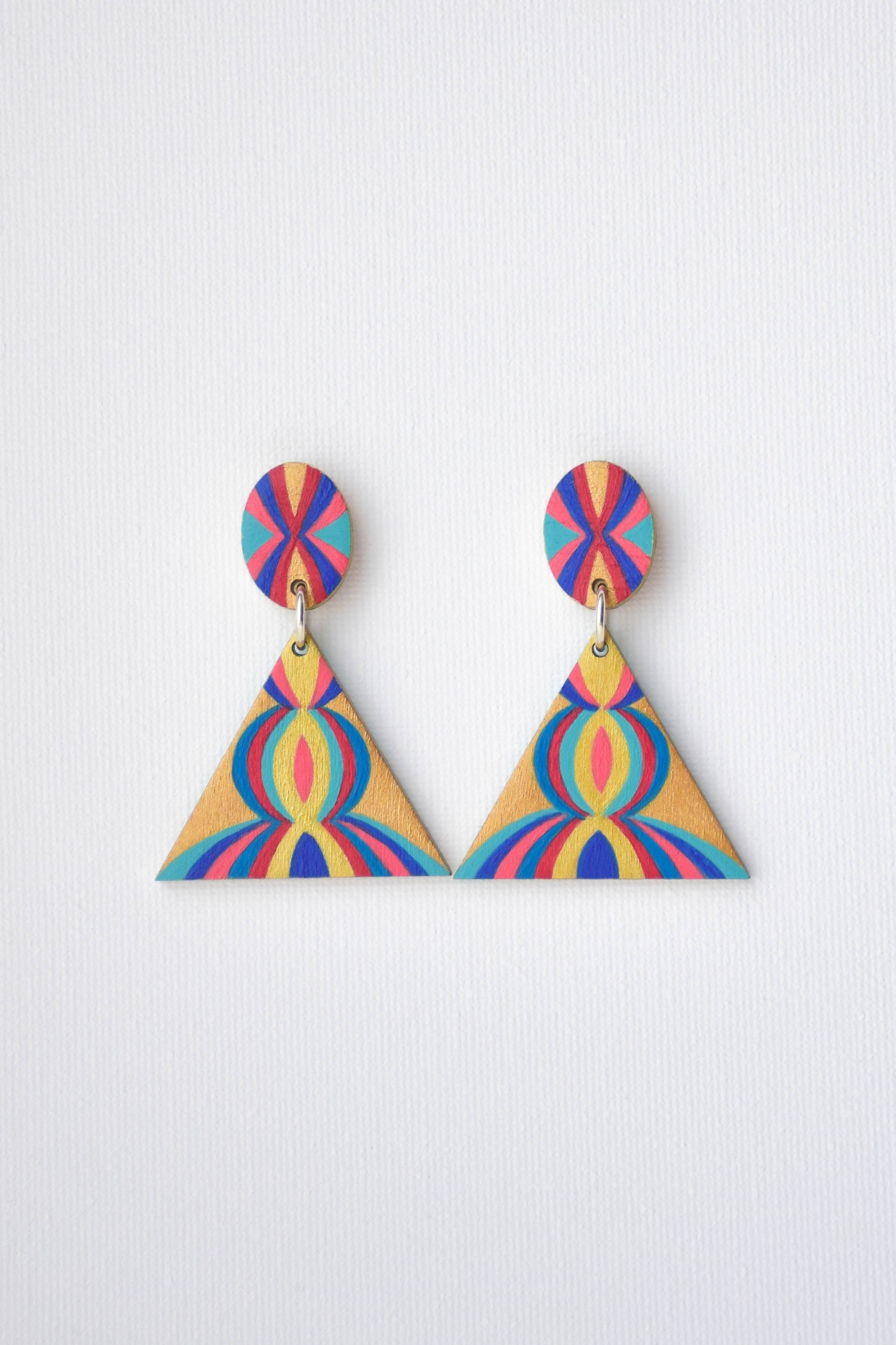 Colorful triangle-shaped earrings on a white background