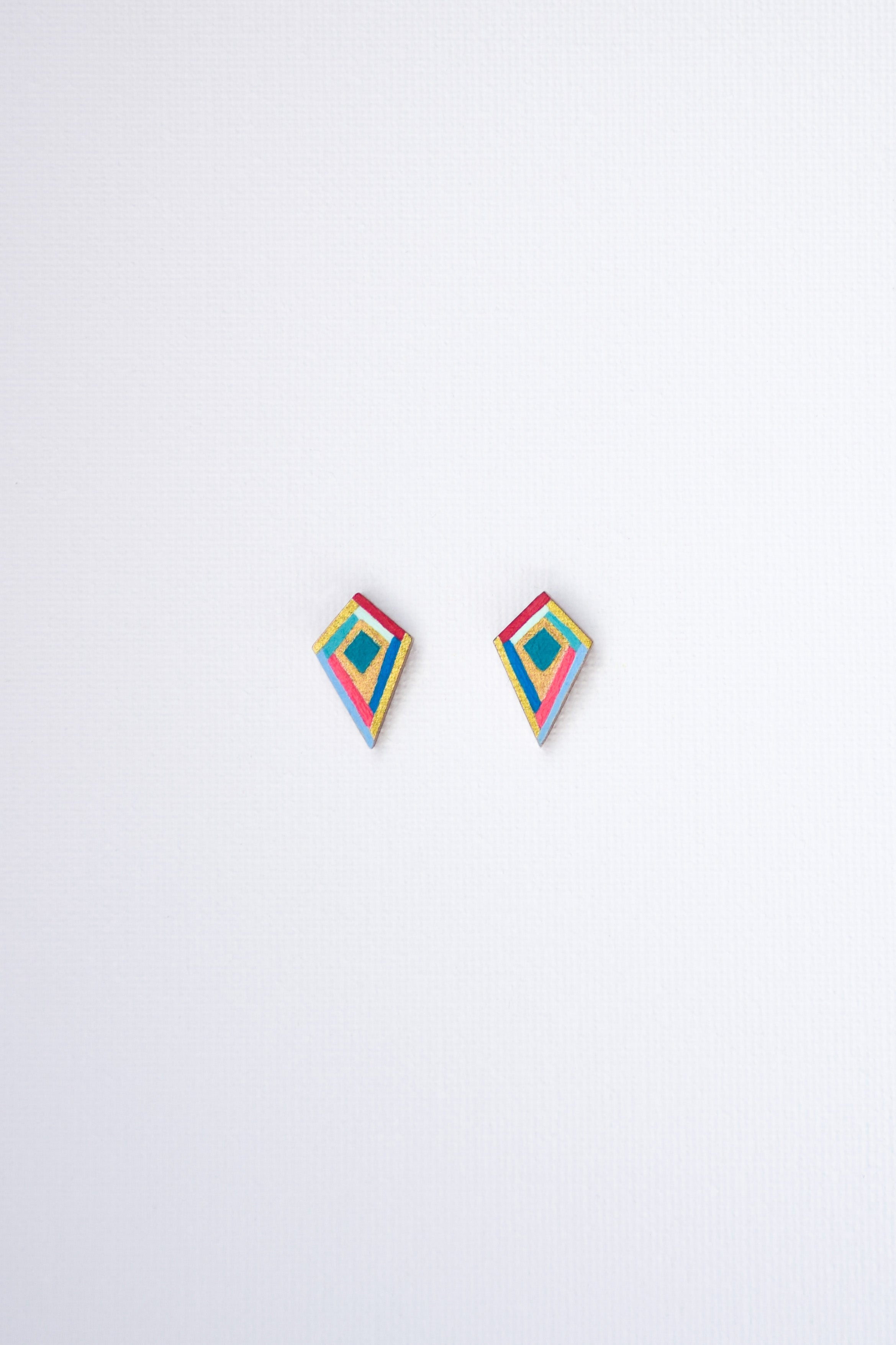 Pair of colorful geometric earrings on a white background
