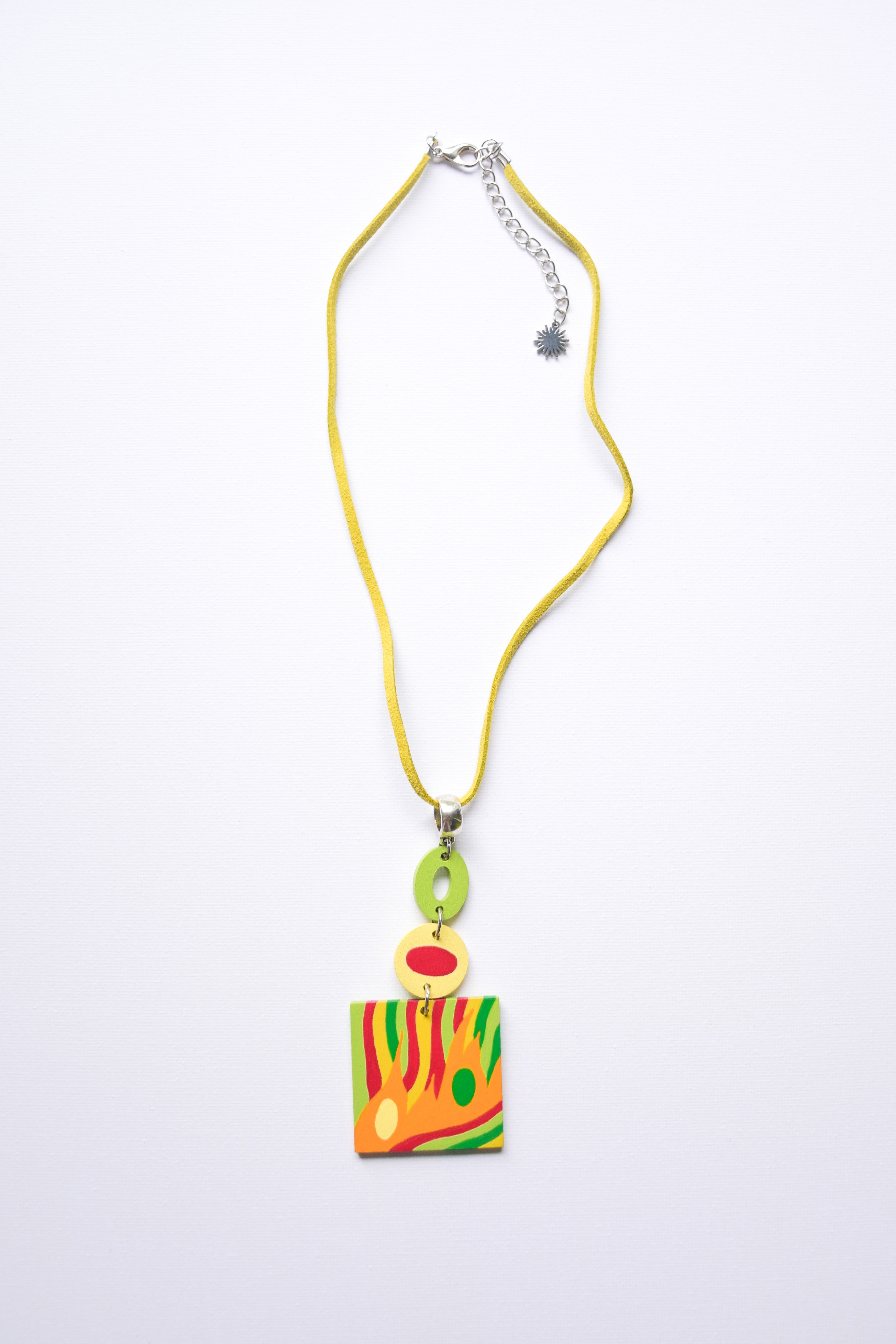 Leather cord necklace with a colorful hand-painted pendant on a white background