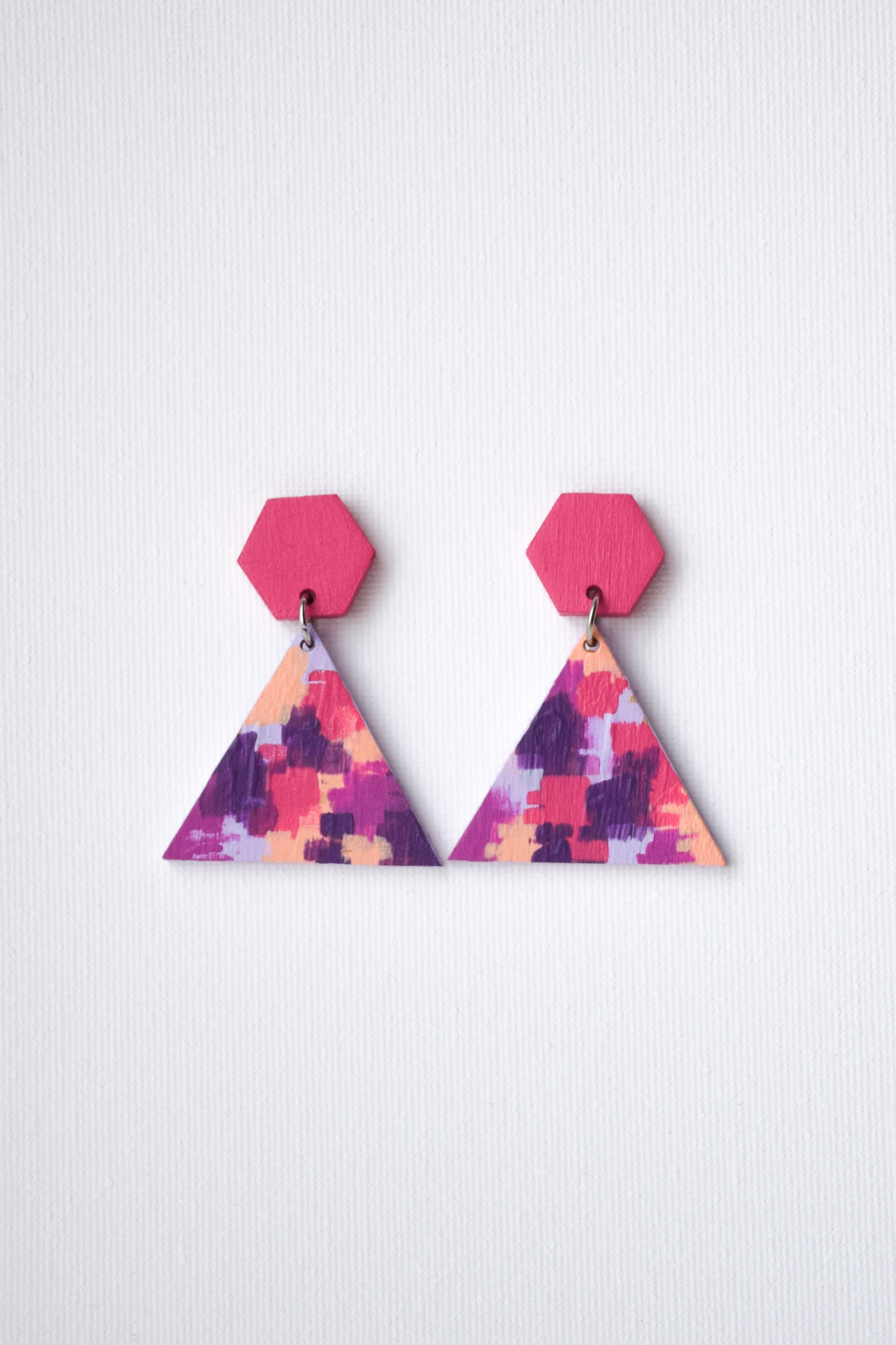 Colorful geometric earrings on a white background