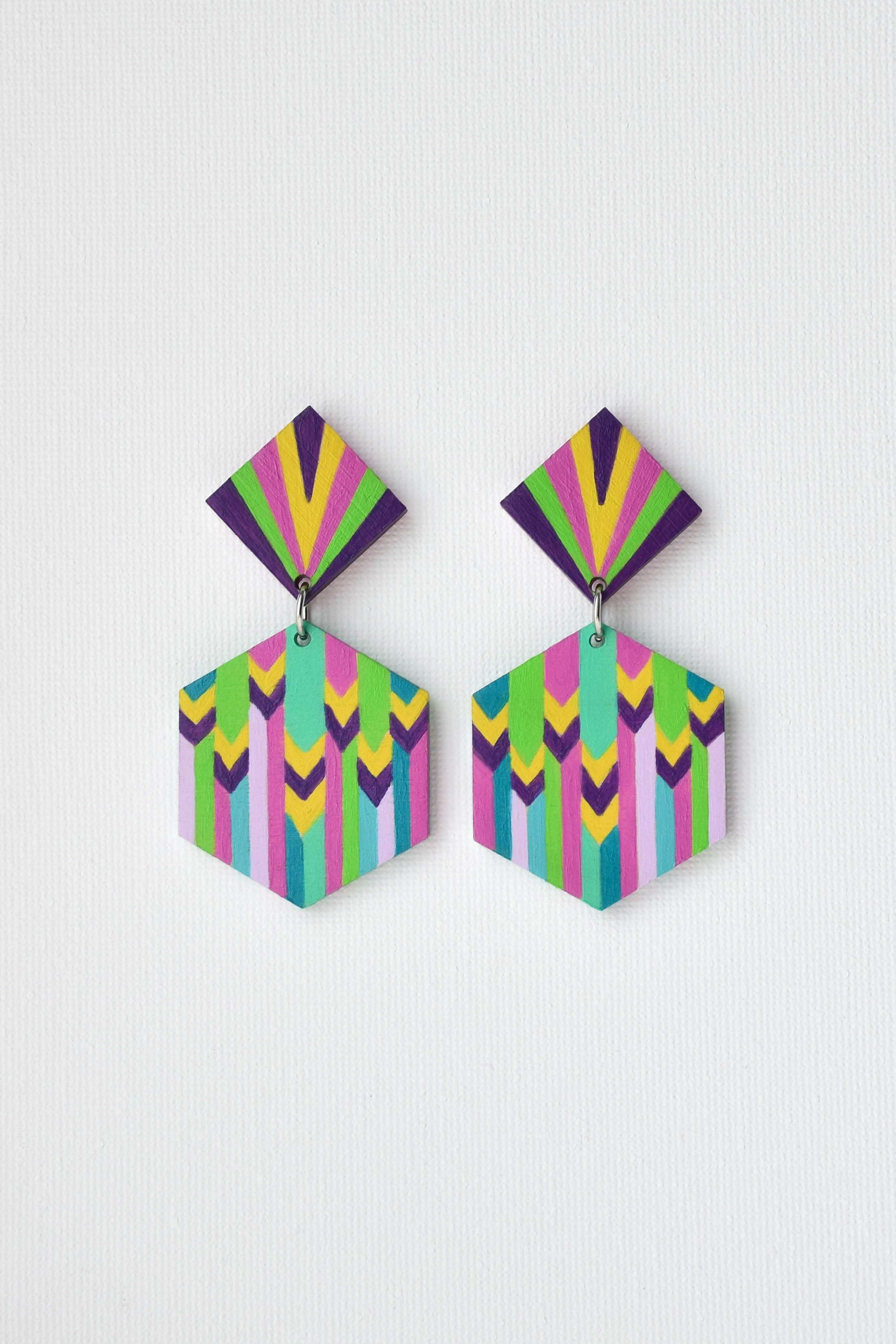 Colorful geometric earrings on a light gray background