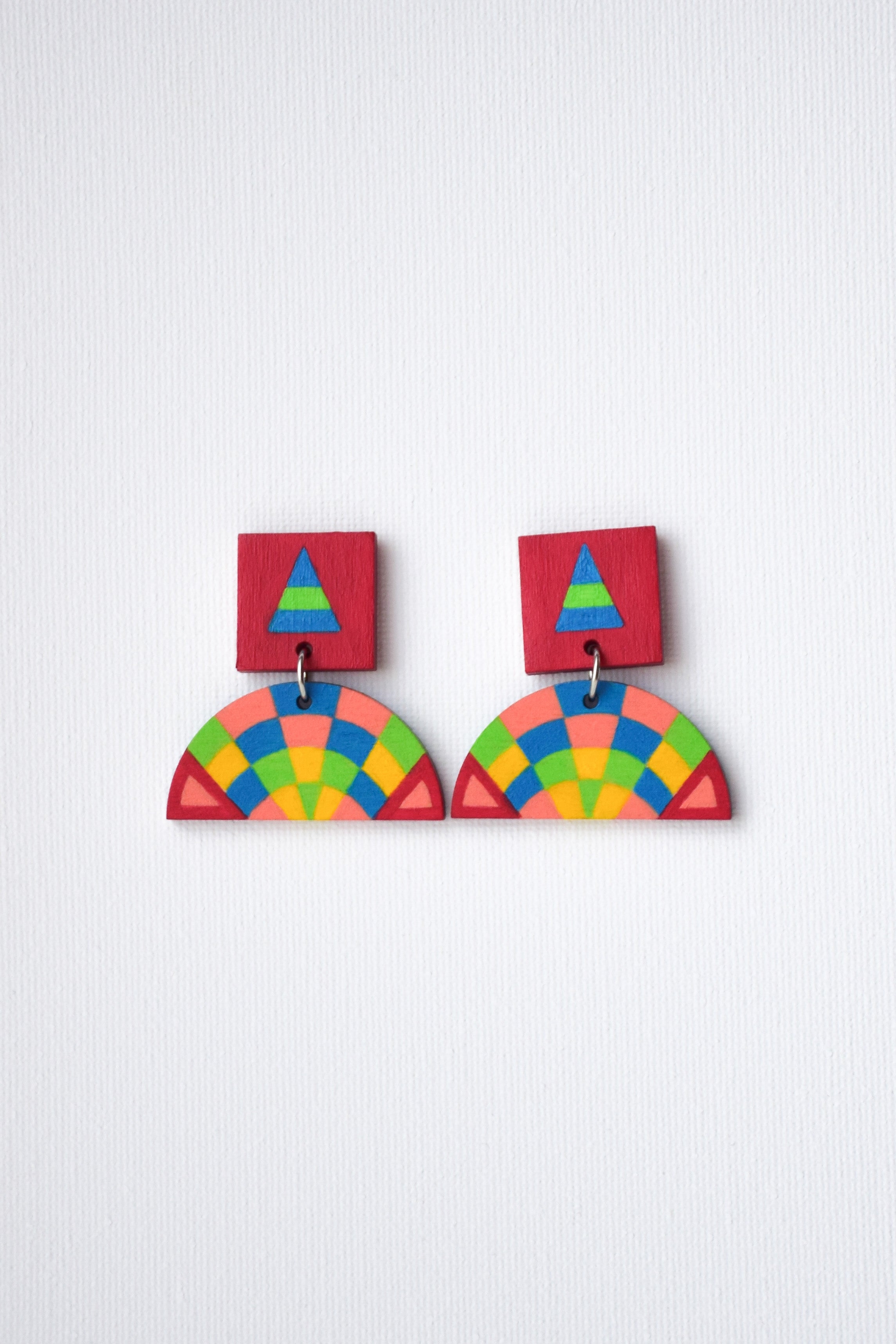 Colorful geometric earrings on a white background