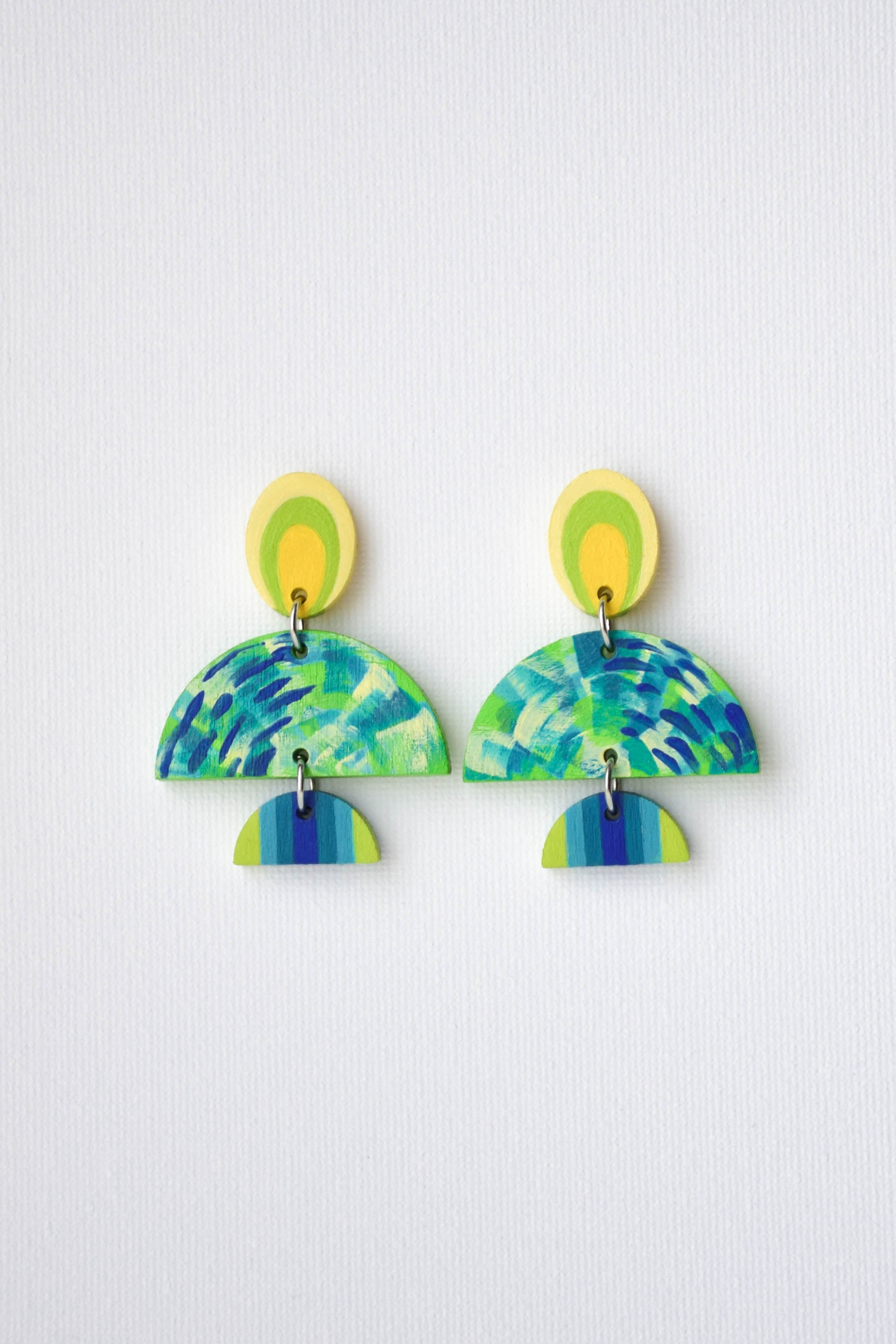 Pair of colorful earrings on a white background