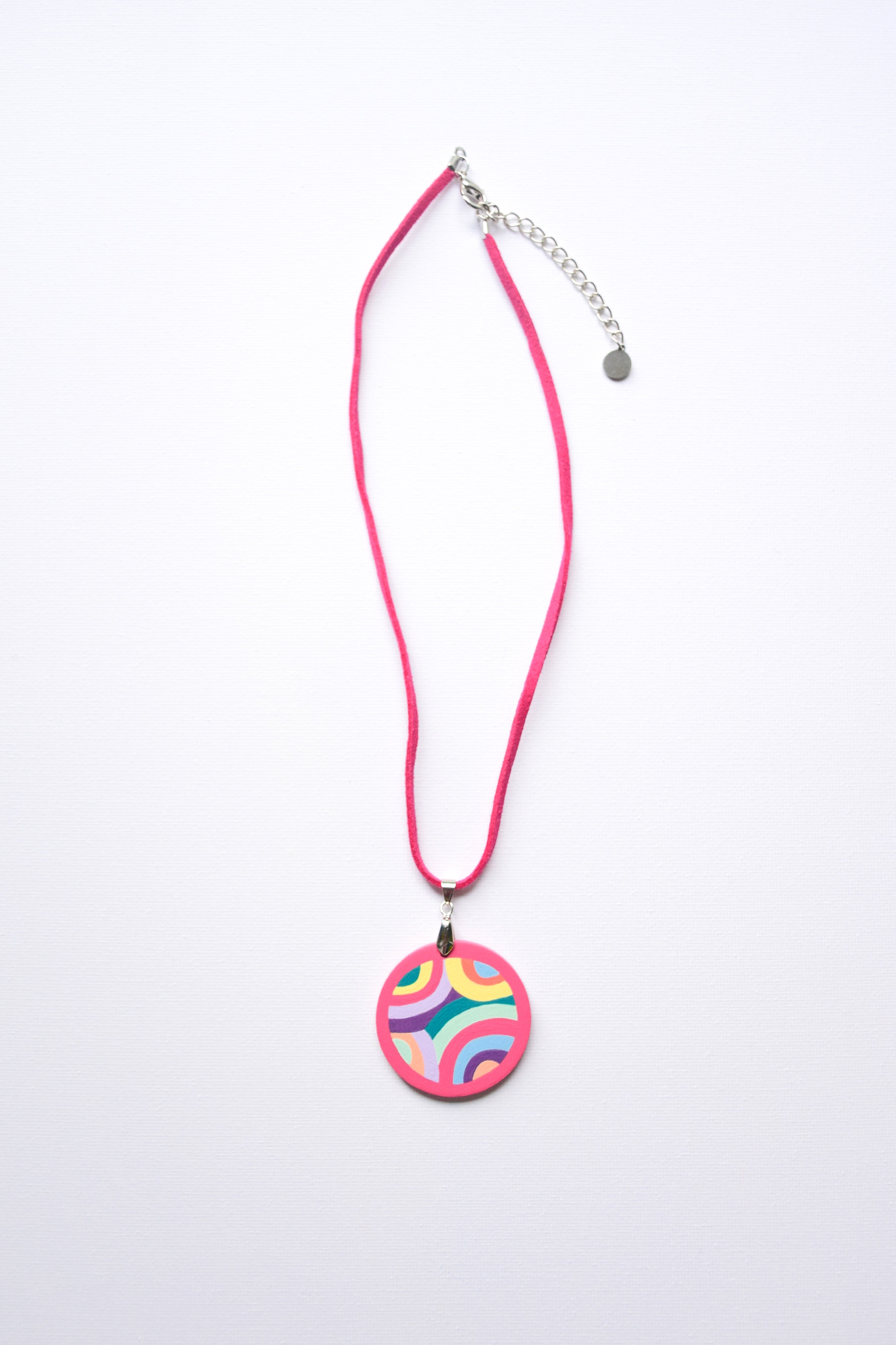 Leather cord necklace with a colorful hand-painted pendant on a white background