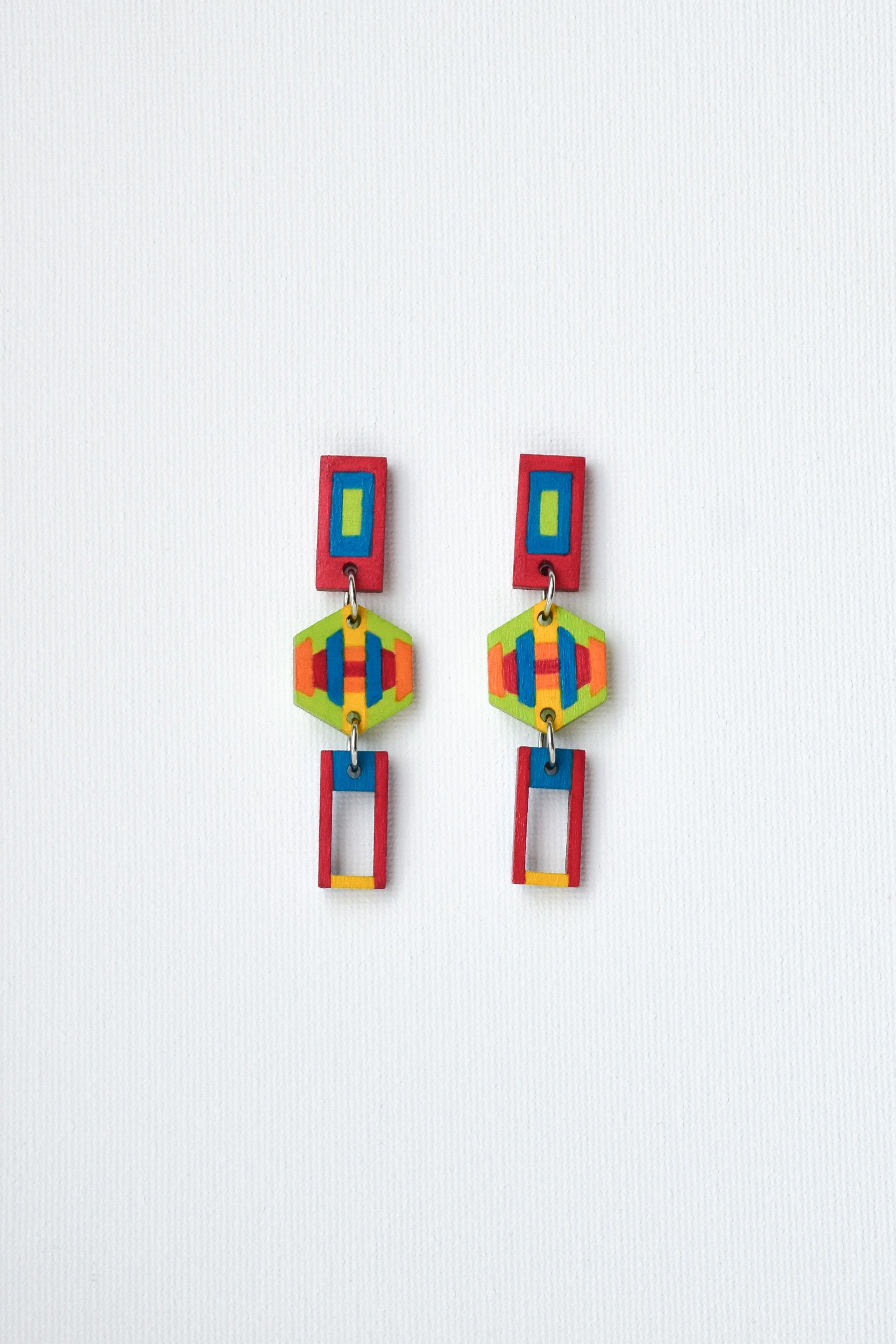 Colorful geometric earrings on a white background