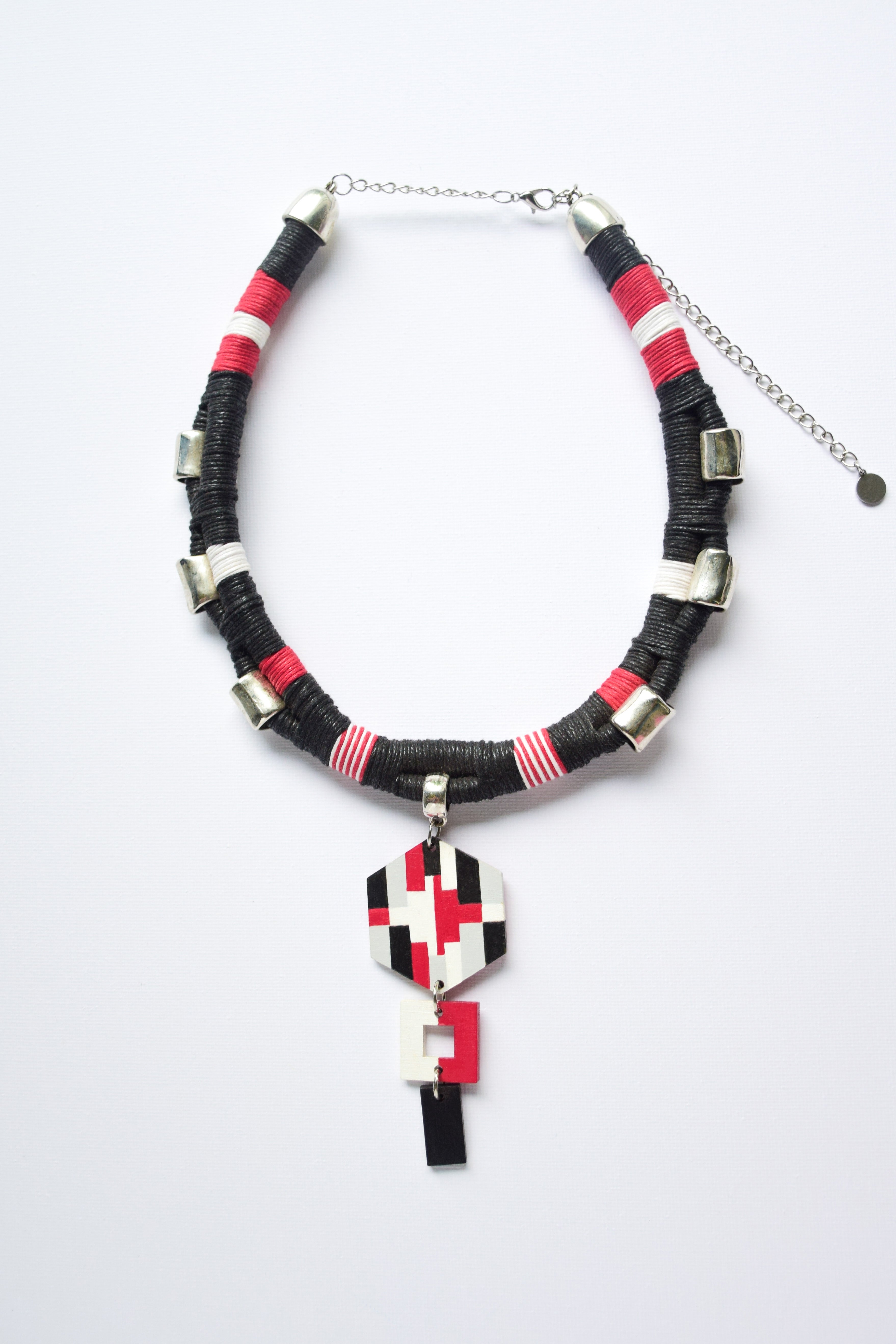 Necklace with geometric pendant on a white background
